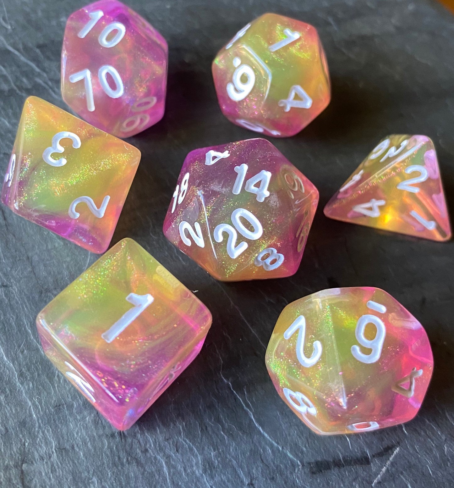 Feather Fall - 7 piece acrylic dice set-glittering blend of yellows and purples with shimmering glitter dust.