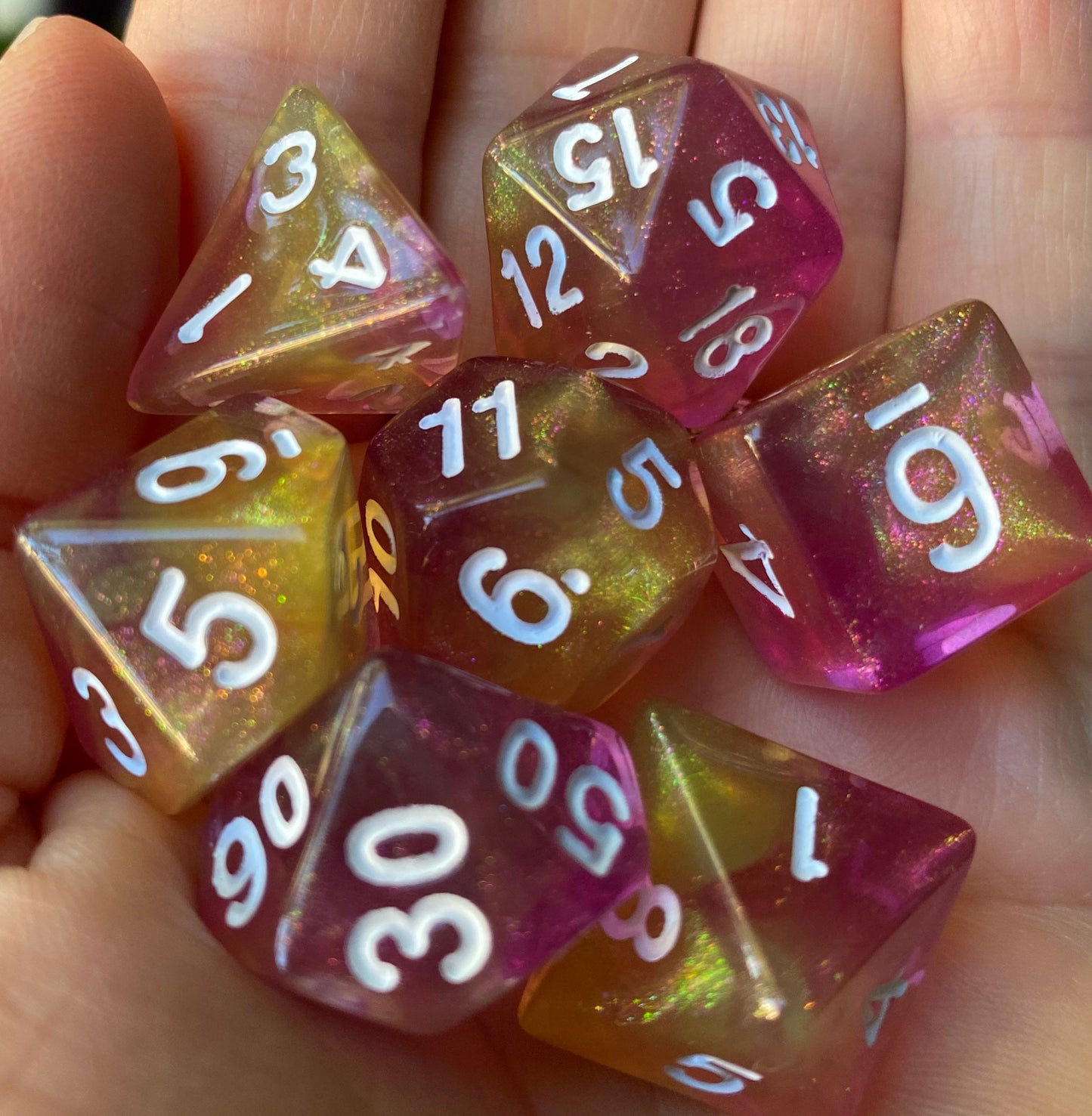 Feather Fall - 7 piece acrylic dice set-glittering blend of yellows and purples with shimmering glitter dust.