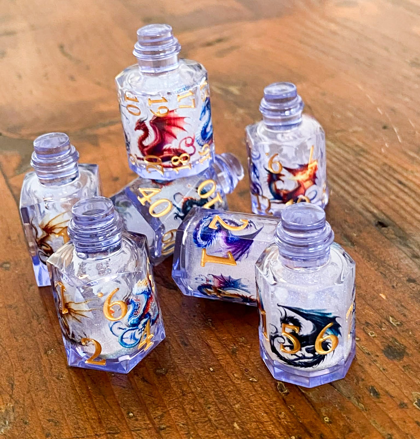Dragon's Bane - Glitter Flowing Core Potion Bottles 7 Piece Dice Set - DnD Dice, Dungeons and Dragons, TTRPGs