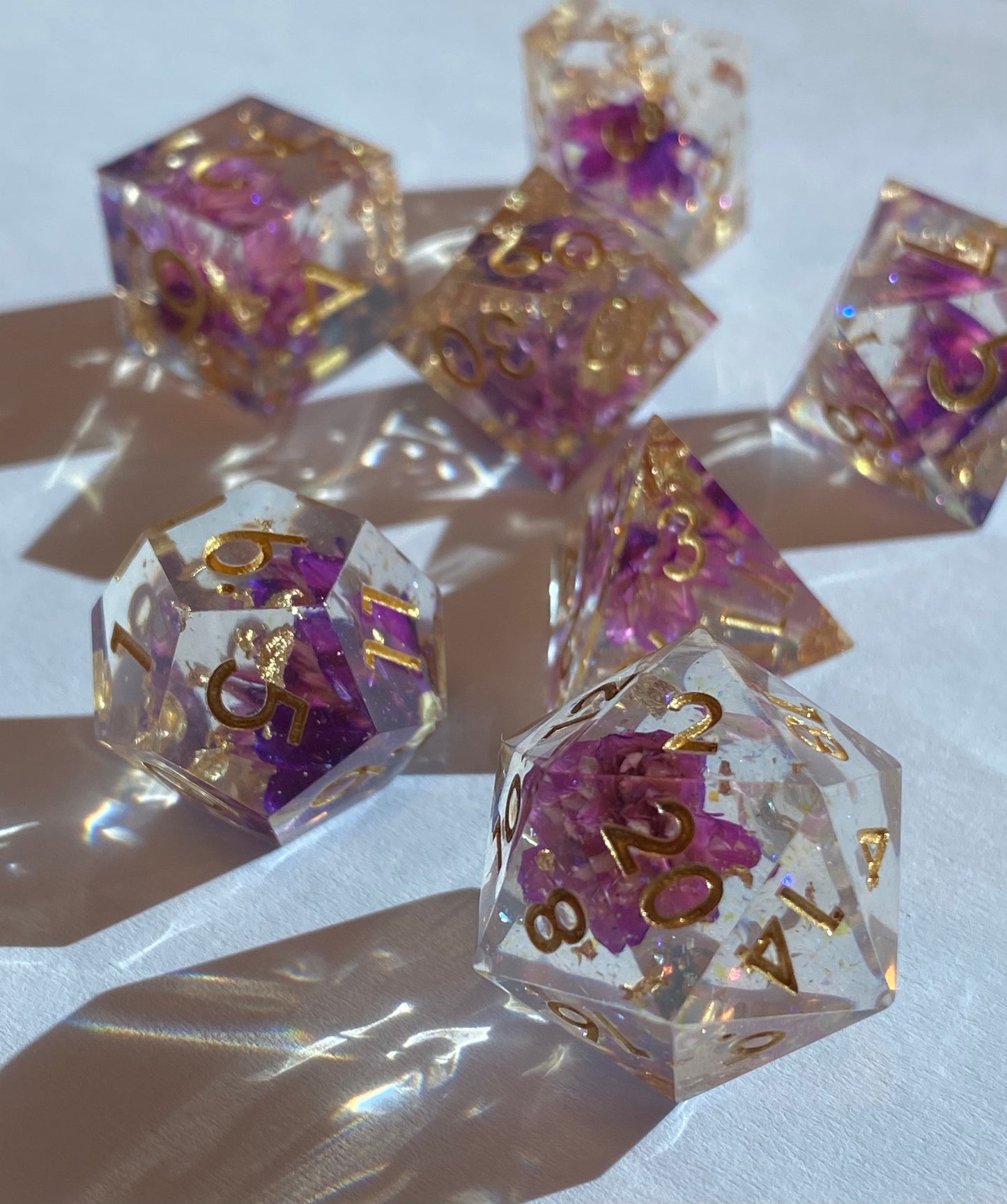 Ceremony - Glittering Clear Sharp Edge 7 Piece Dice Set - Purple Flowers and Gold Leaf With Violet Prismatic Glitter- DnD, TTRPGs